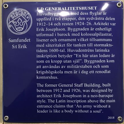 Blå emaljerad skylt med vit text
