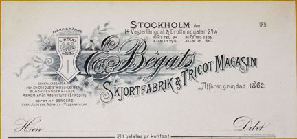 Brevhuvud tryckt i svart med dekorationer och text.