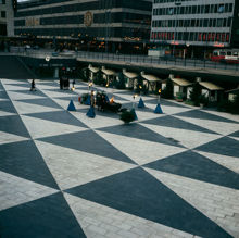 Facklor, bodar och julgranar på Sergels Torg. Vy mot Åhléns